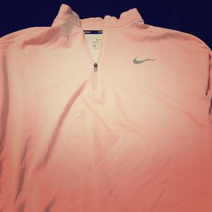 Coral/peach colored Nike lightweight quarter zip